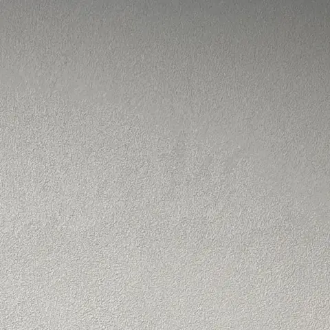 Close-up of a textured render finish on an entry wall